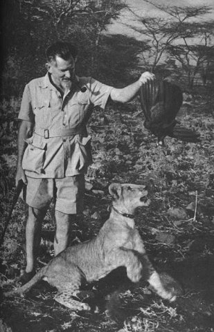 GeorgeAdamsonStandingWithElsaLookingAtBirdOffering_Kenya